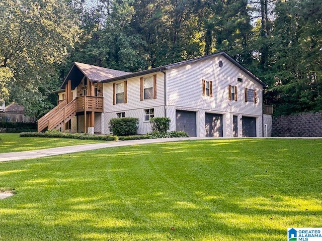 view of front facade featuring a wooden deck, a garage, and a front lawn