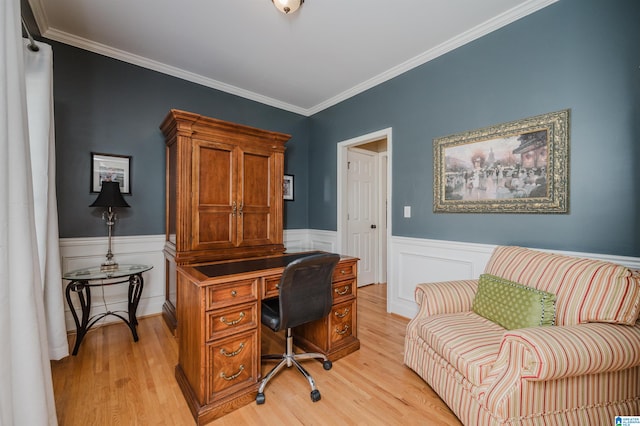 home office featuring light wood-type flooring and ornamental molding