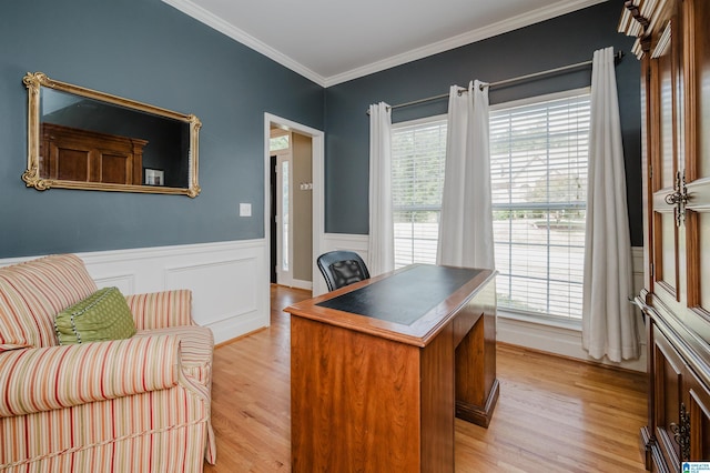 office featuring light wood-style floors, a wainscoted wall, and ornamental molding