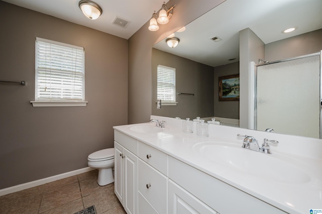 bathroom with walk in shower, vanity, toilet, and tile patterned floors