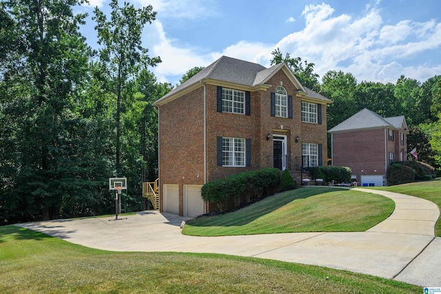 colonial home featuring an attached garage, a front lawn, brick siding, and concrete driveway