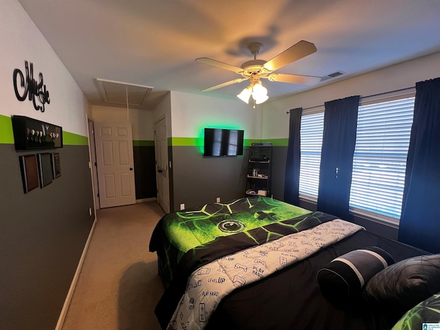 bedroom featuring attic access, ceiling fan, light carpet, baseboards, and visible vents
