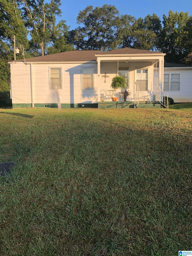 view of front of property with a front yard and a porch