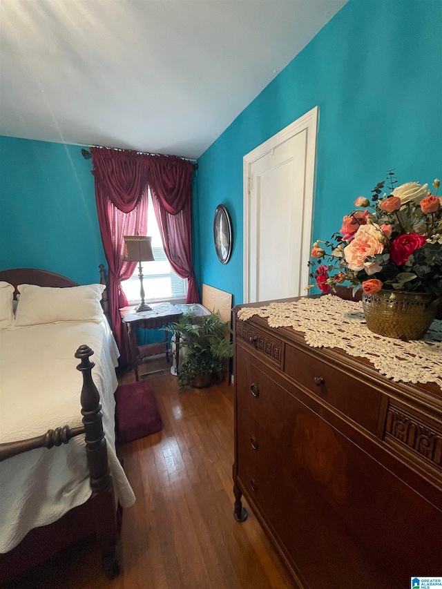 bedroom with hardwood / wood-style floors