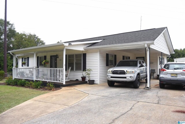 view of front of property with covered porch and a front yard