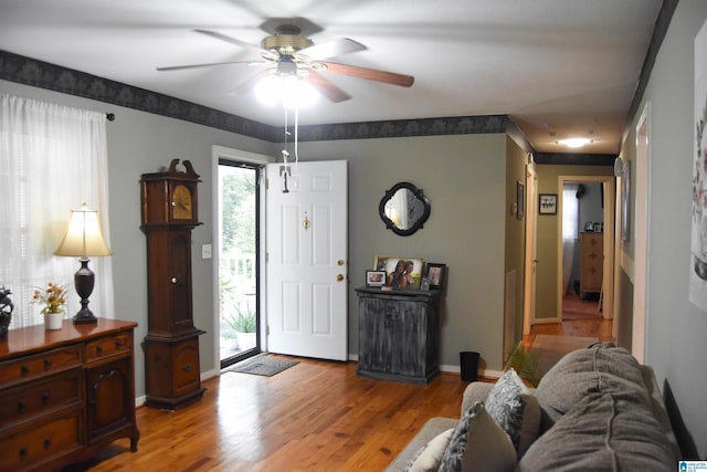 entrance foyer with hardwood / wood-style floors, ceiling fan, and a healthy amount of sunlight