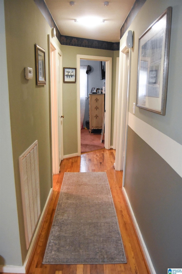 hallway featuring light hardwood / wood-style flooring