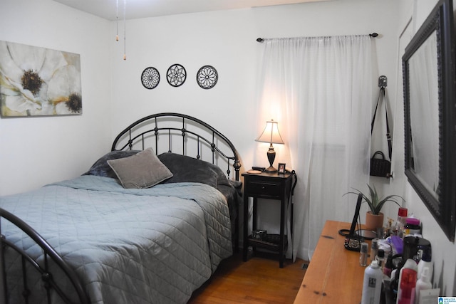 bedroom featuring hardwood / wood-style flooring