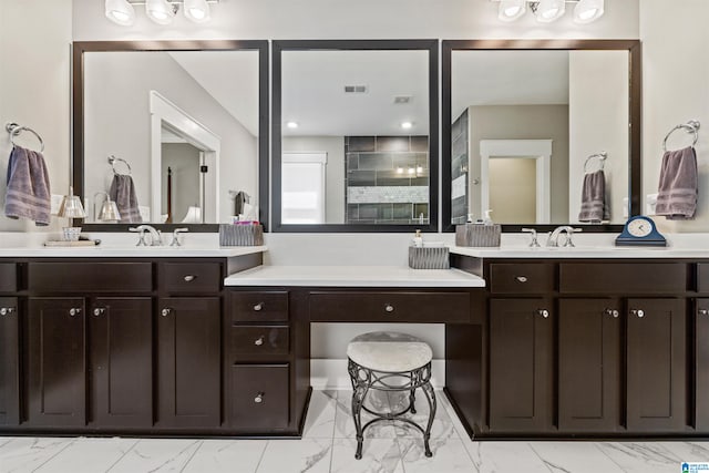 bathroom featuring a shower and vanity