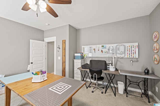 office area with ceiling fan and light colored carpet