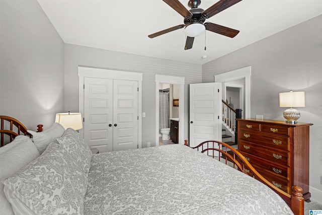 bedroom with ceiling fan, ensuite bath, and a closet