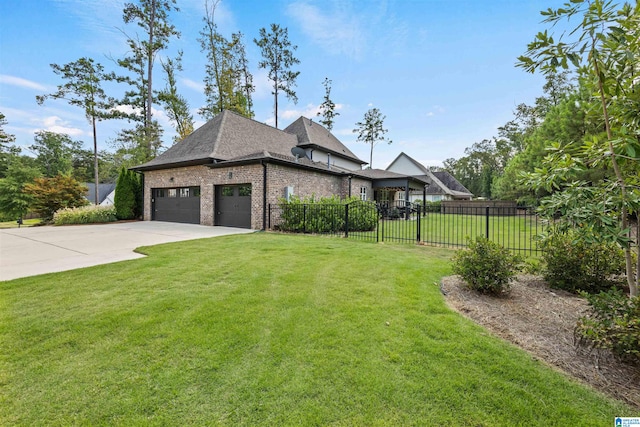 view of front of property with a front yard and a garage