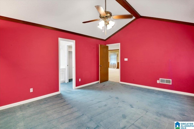 spare room with carpet flooring, ceiling fan, and lofted ceiling with beams