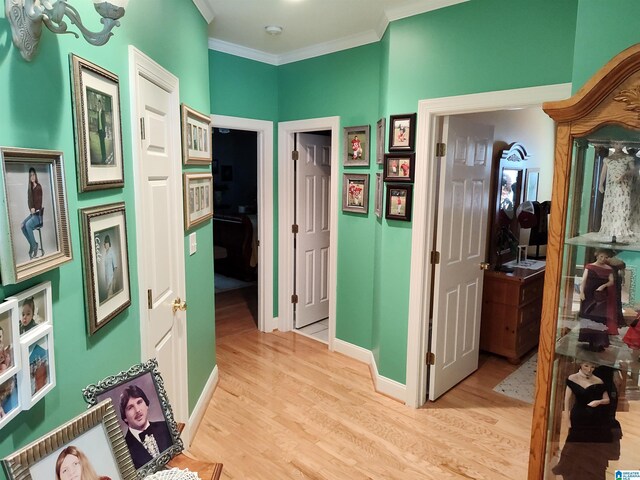 bathroom with a tub and ornamental molding