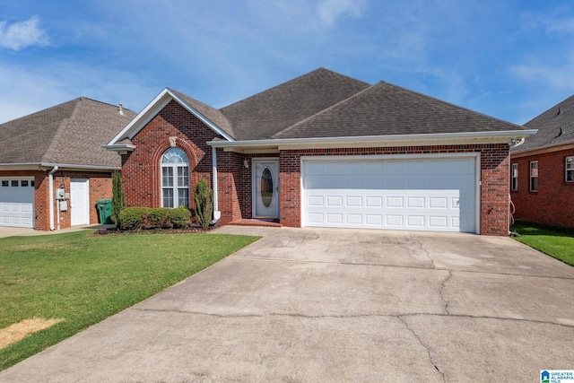 view of front facade featuring a garage and a front lawn