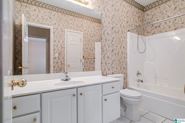 full bathroom with shower / tub combination, tile patterned floors, toilet, and vanity