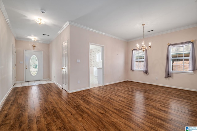 entrance foyer featuring a wealth of natural light, dark hardwood / wood-style floors, and ornamental molding