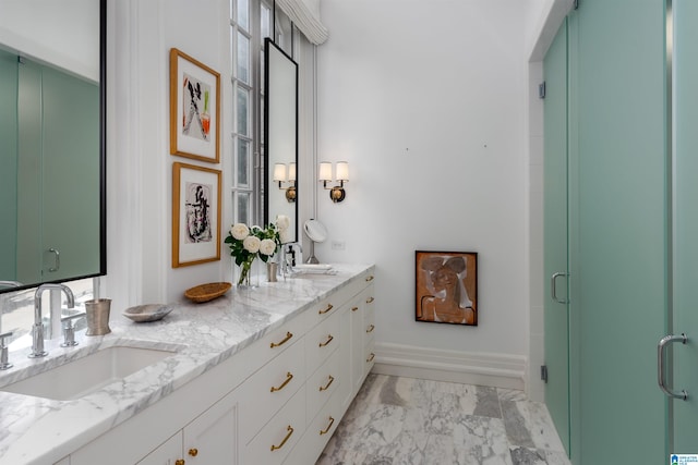 bathroom featuring walk in shower and vanity