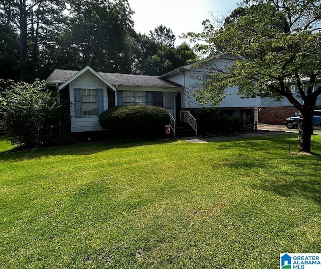 split level home featuring a front lawn