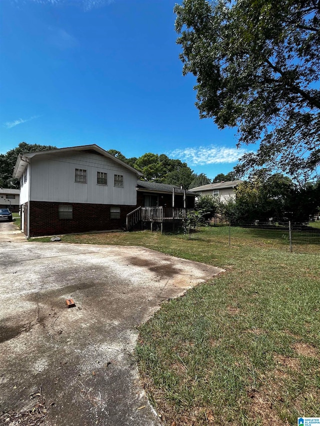 view of side of property with a yard