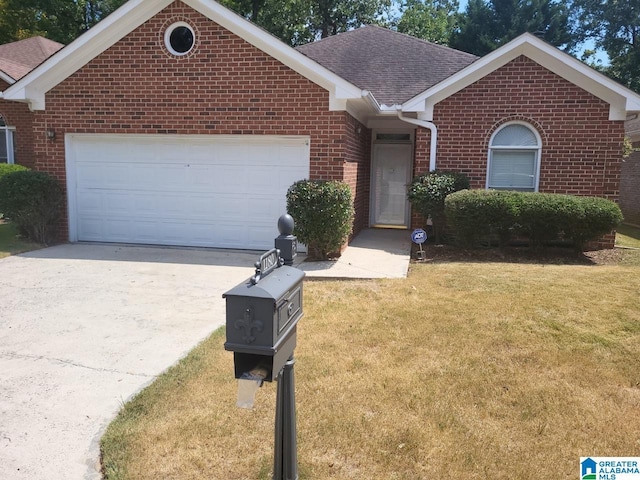 ranch-style home with a garage and a front lawn