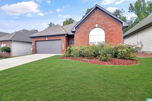 view of front of house featuring a garage and a front yard