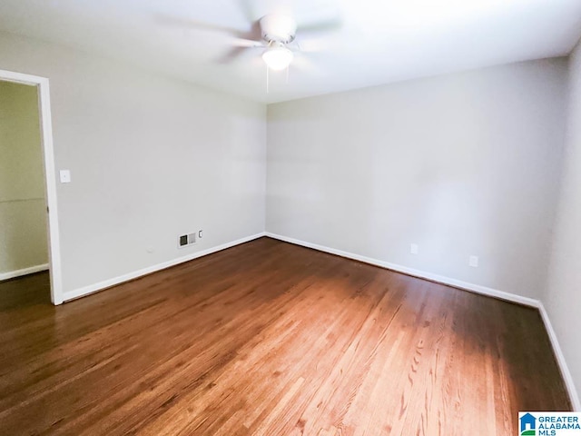 unfurnished room with ceiling fan and hardwood / wood-style floors