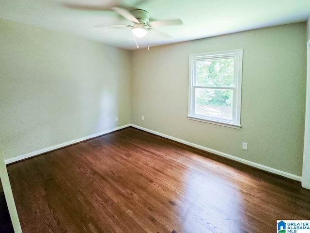 unfurnished room with ceiling fan and dark hardwood / wood-style floors