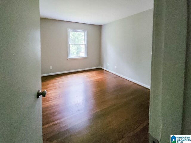 spare room featuring hardwood / wood-style flooring