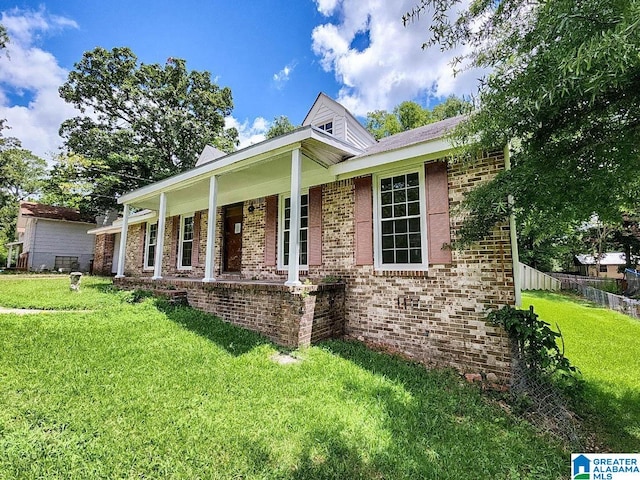 view of front of property with a front yard and a porch