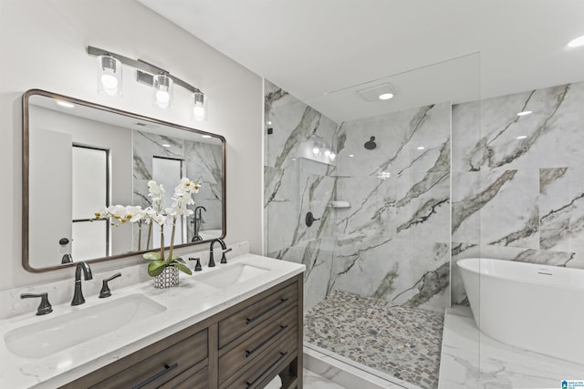 bathroom featuring a marble finish shower, marble finish floor, a sink, and double vanity