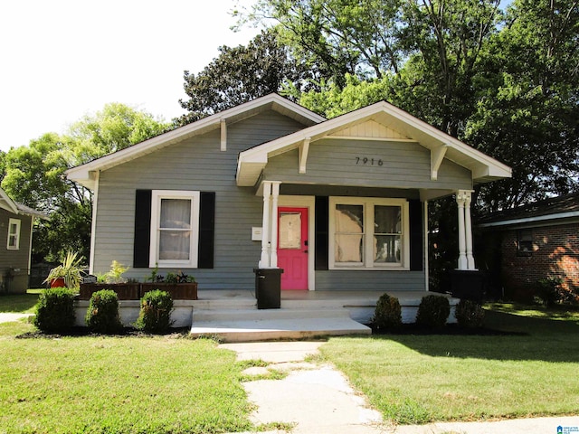 view of front of house featuring a front lawn and covered porch