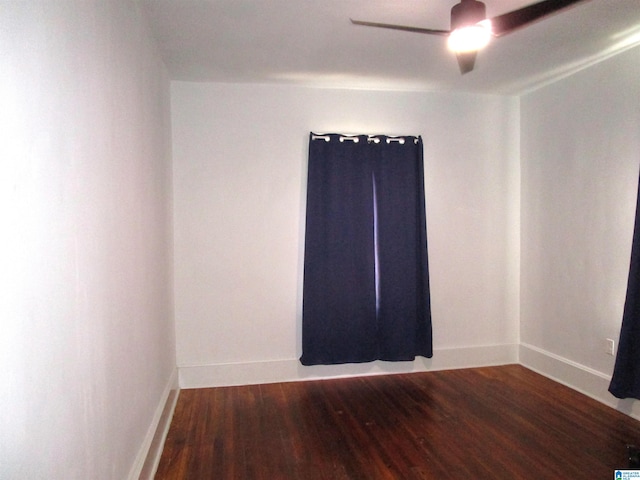 spare room with wood-type flooring and ceiling fan