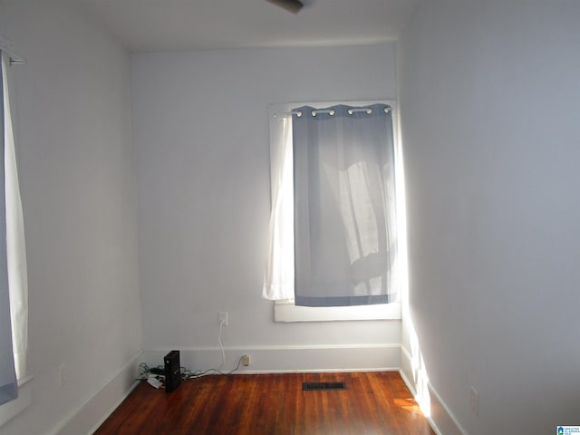 unfurnished room featuring wood-type flooring