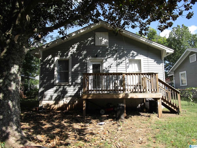 rear view of house with a wooden deck