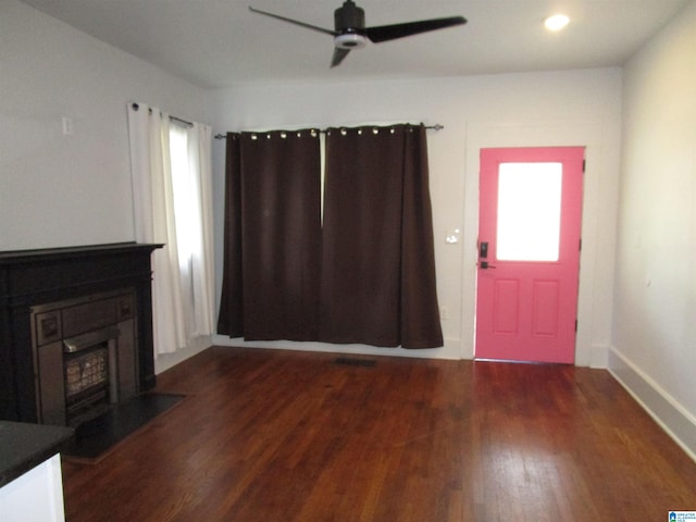 entryway featuring ceiling fan and dark hardwood / wood-style floors