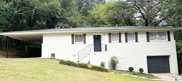 view of front of property featuring a garage, a carport, and a front lawn