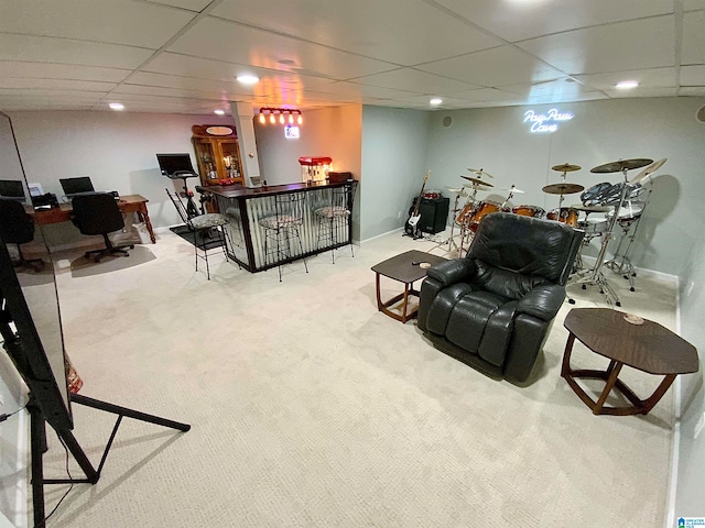 living room with light carpet, a paneled ceiling, and bar