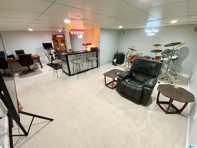 living room featuring a paneled ceiling, indoor bar, and light carpet