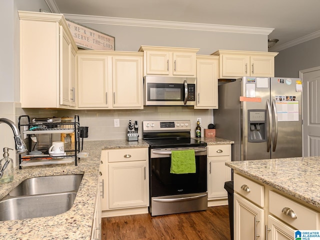 kitchen with cream cabinetry, ornamental molding, stainless steel appliances, dark hardwood / wood-style flooring, and sink