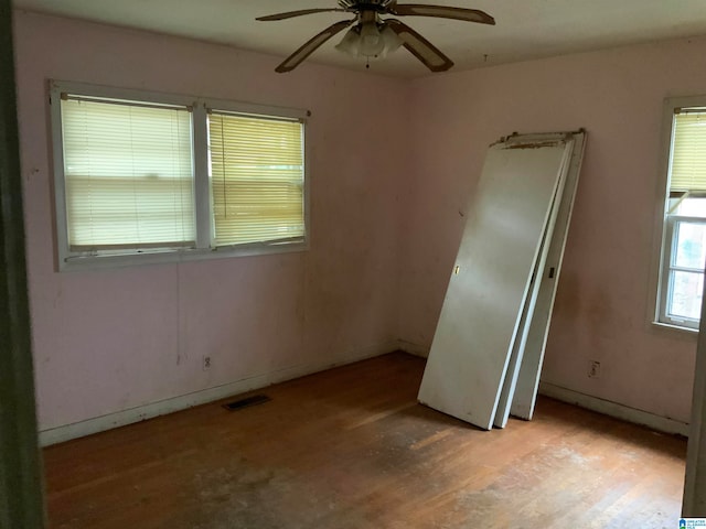 spare room with ceiling fan and light hardwood / wood-style floors