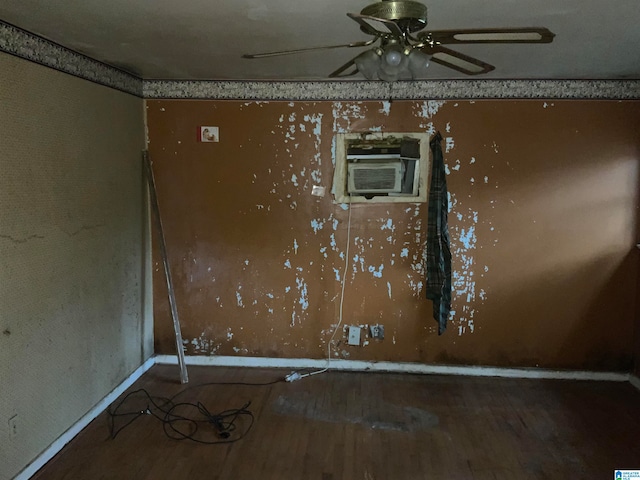 spare room with ceiling fan and hardwood / wood-style flooring