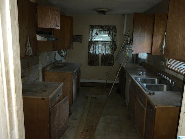 kitchen featuring decorative backsplash and sink