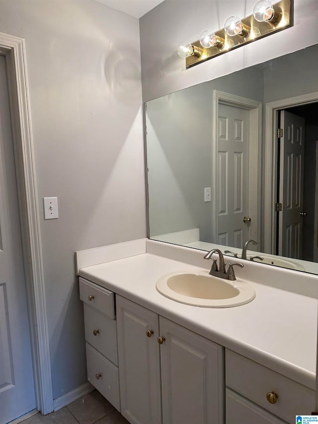 bathroom with tile patterned flooring and vanity