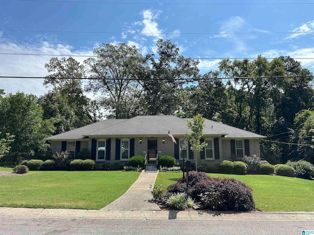 single story home featuring a front yard