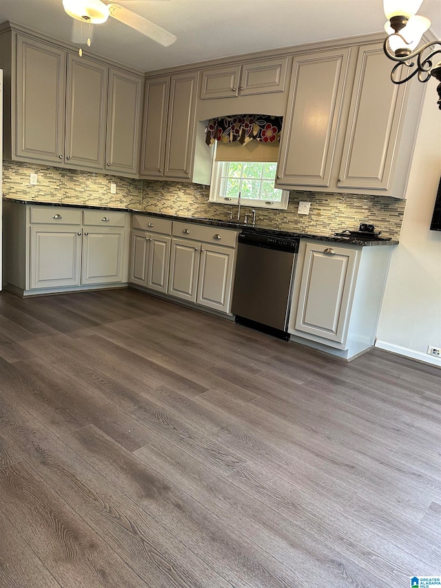 kitchen with stainless steel dishwasher, gray cabinetry, ceiling fan with notable chandelier, sink, and dark hardwood / wood-style floors