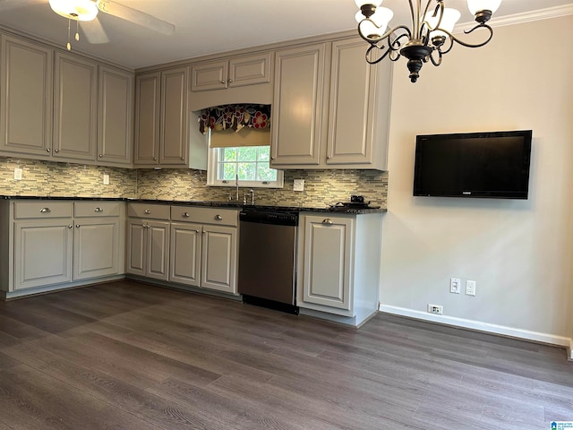 kitchen featuring sink, dark wood-type flooring, stainless steel dishwasher, pendant lighting, and ceiling fan with notable chandelier