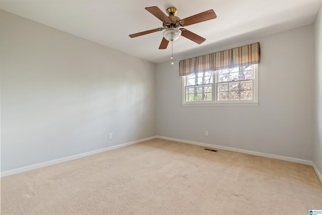 carpeted empty room with ceiling fan