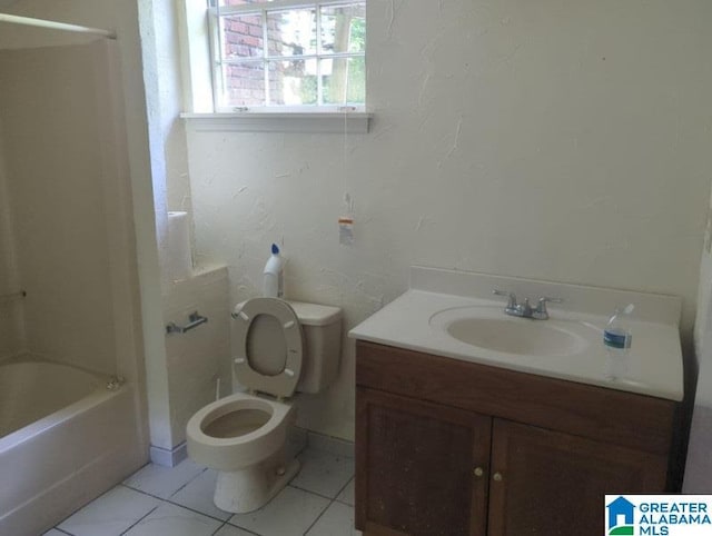 bathroom featuring washtub / shower combination, tile patterned flooring, vanity, and toilet