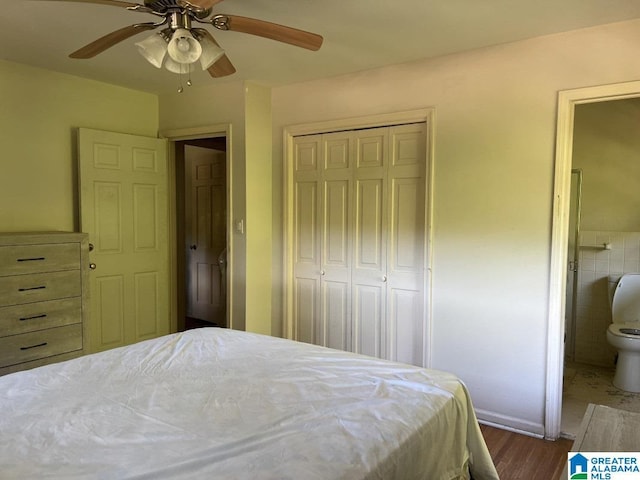 bedroom featuring ensuite bath, a closet, ceiling fan, and wood finished floors